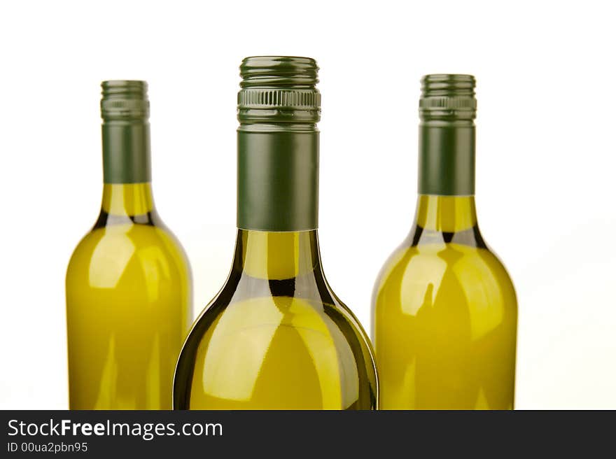 White wine bottles isolated against a white background