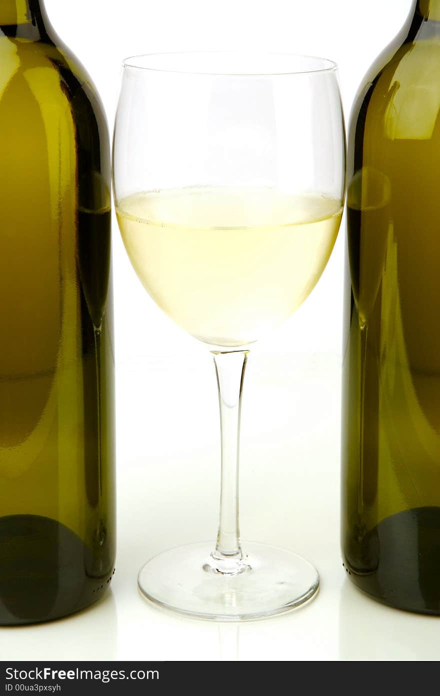 White wine bottles isolated against a white background