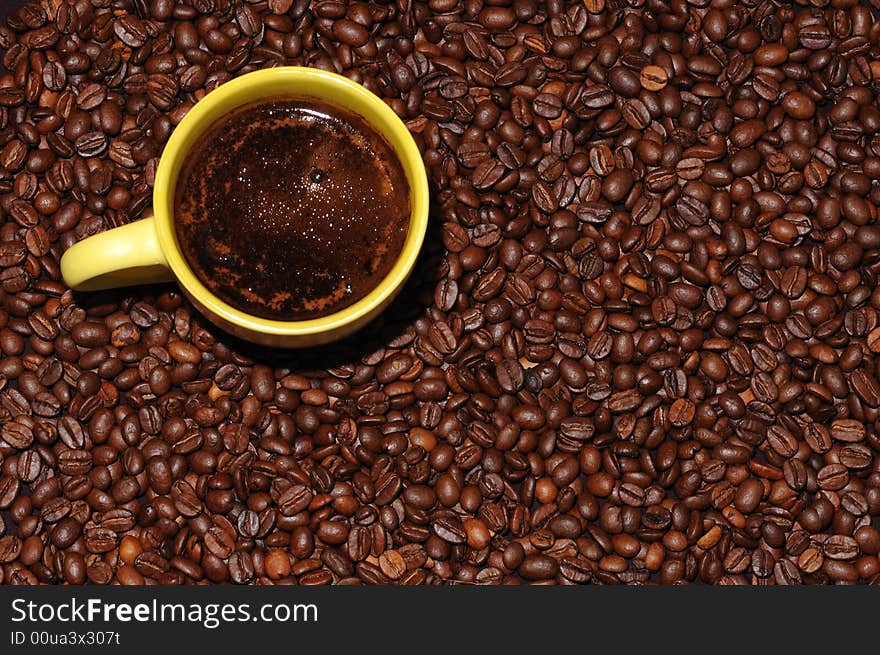 Coffee cup standing on coffee beans. Coffee cup standing on coffee beans