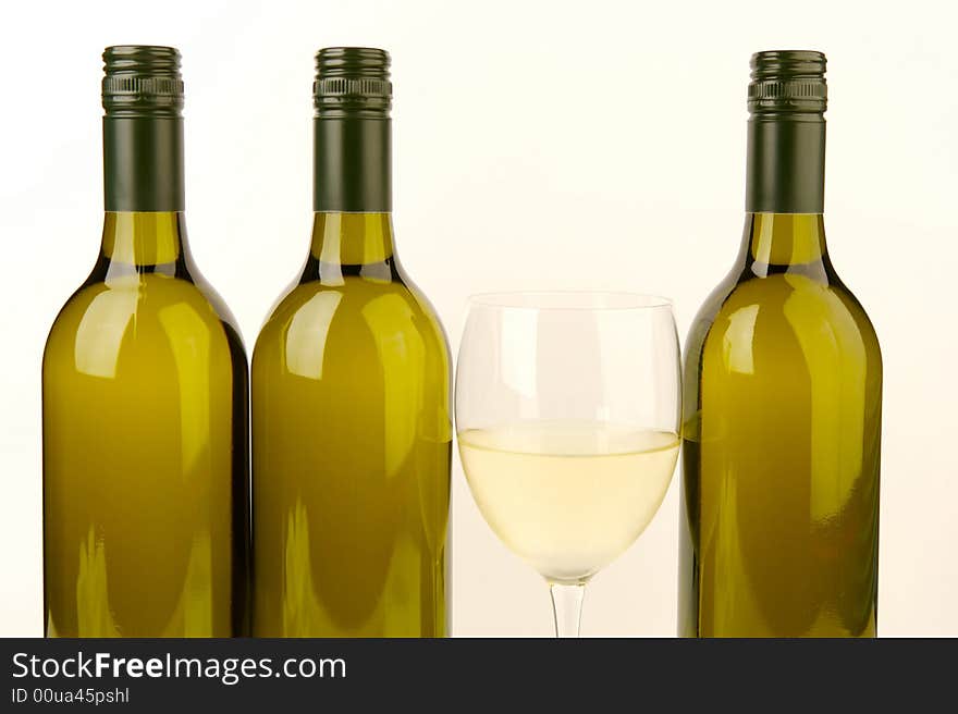 White wine bottles isolated against a white background