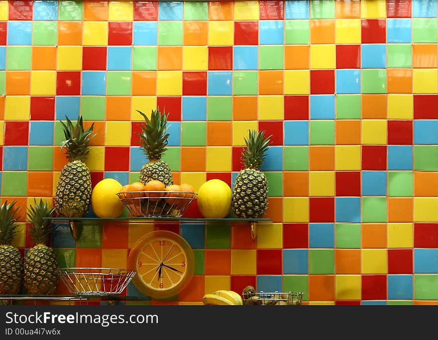 Colorful wall with a clock and fruit. Colorful wall with a clock and fruit