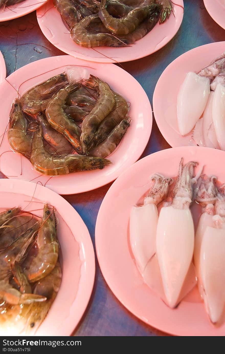 Seafood market for sale on pink plates