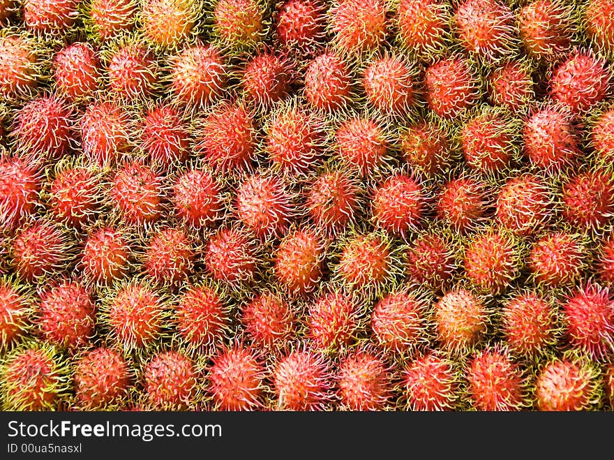 A big pile of rambutan fruit for sale