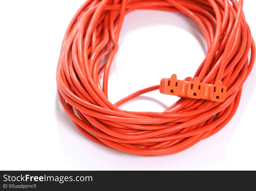 A 100 foot orange extension cord coiled up with a three way splitter