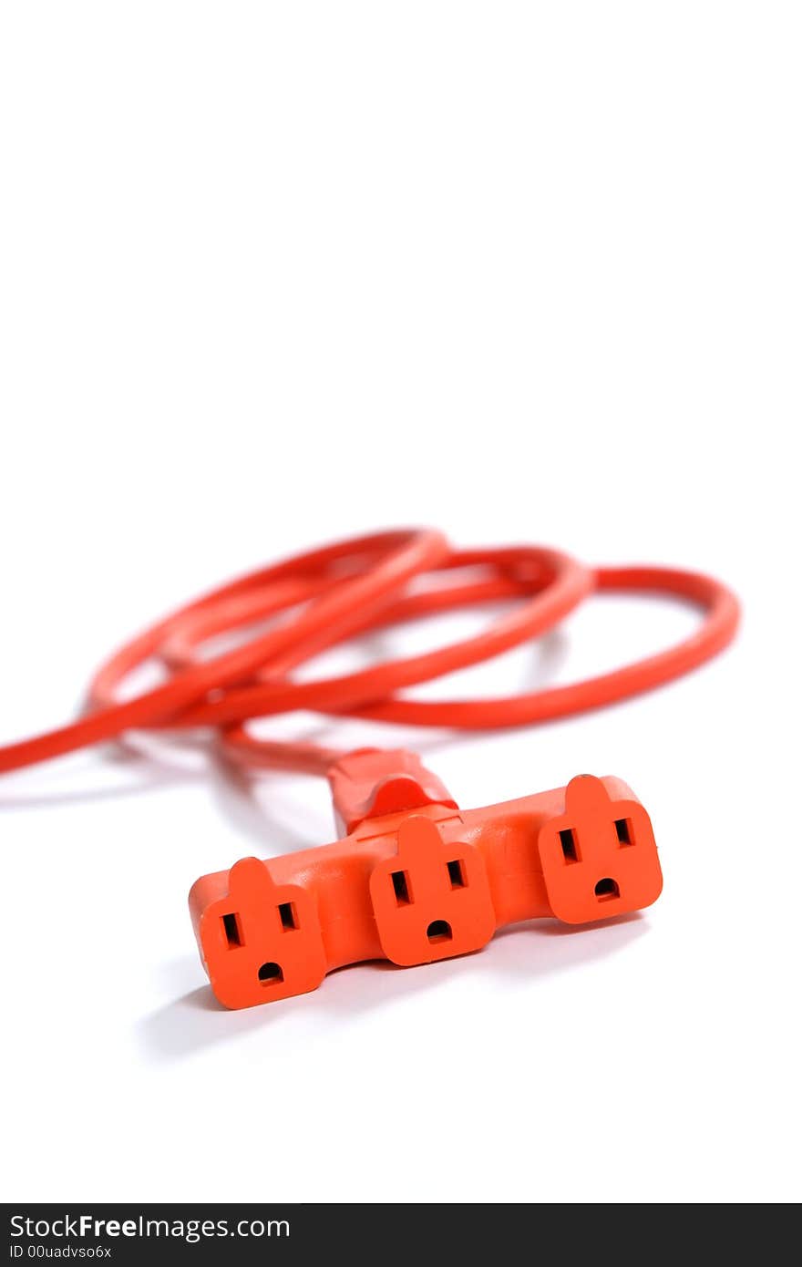 A 100 foot orange extension cord coiled up with a three way splitter