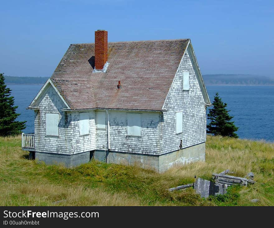 Old abandoned boarded up house, on Moshers Island Lighthouse Lahave Lunenburg County Nova Scotia Canada. Old abandoned boarded up house, on Moshers Island Lighthouse Lahave Lunenburg County Nova Scotia Canada