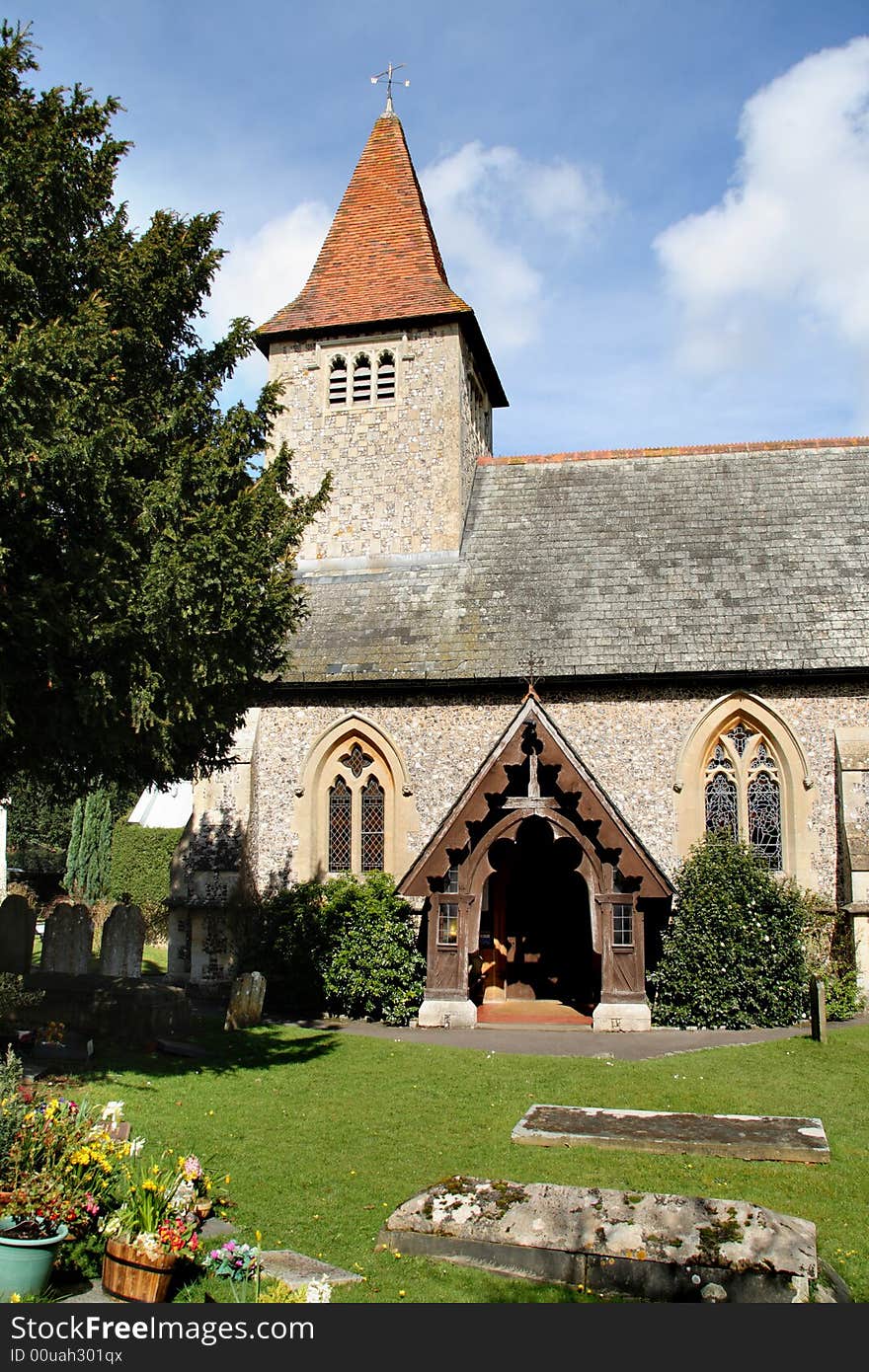 English Village Church with Bell Tower and arched entrance doorway