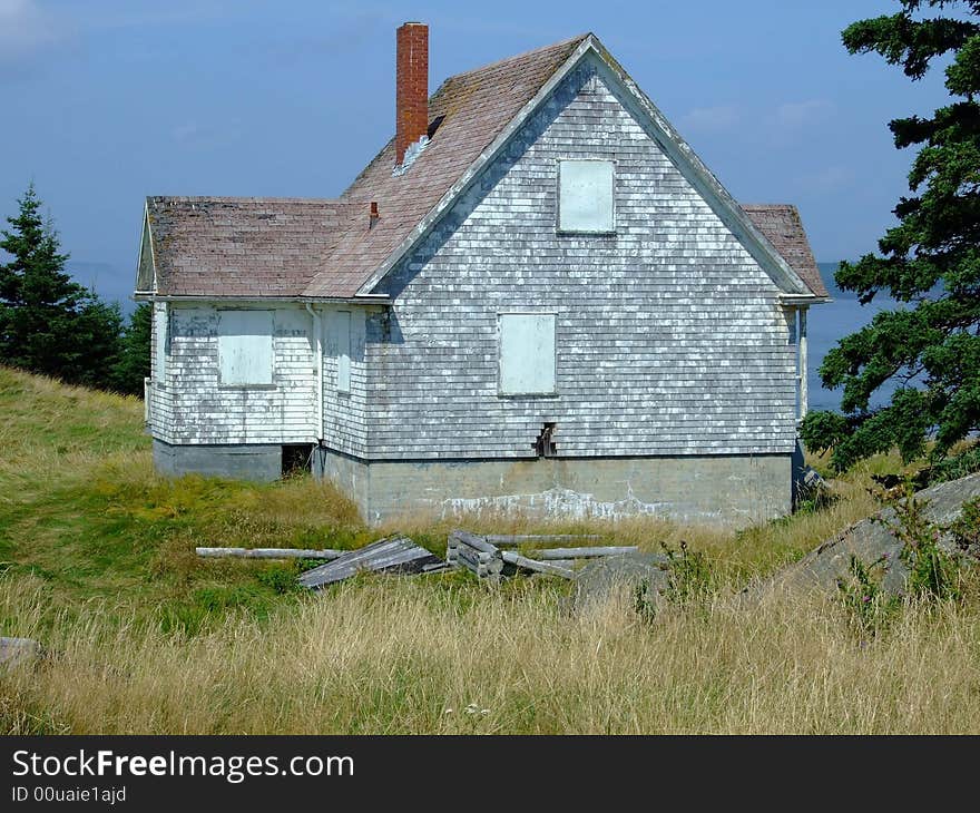 Old abandoned boarded up house, on Moshers Island Lighthouse Lahave Lunenburg County Nova Scotia Canada. Old abandoned boarded up house, on Moshers Island Lighthouse Lahave Lunenburg County Nova Scotia Canada