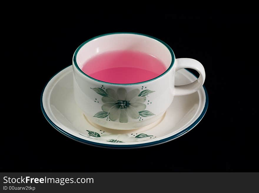 A cup of tea which made from strawberry. A cup of tea which made from strawberry