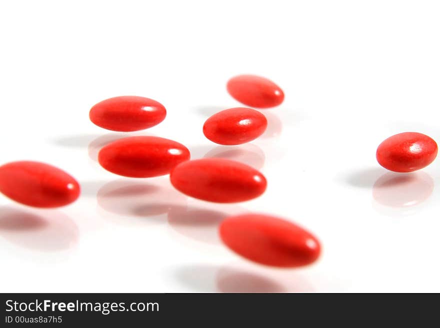 A few medicine tablets on a table