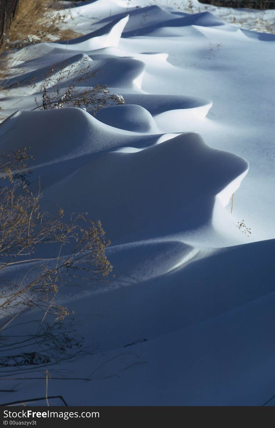 A snow field blown by the wind. A snow field blown by the wind