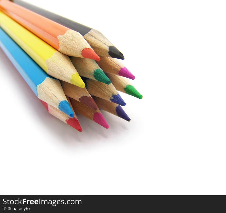 Colored pencils on a white background. Close-up. Macro