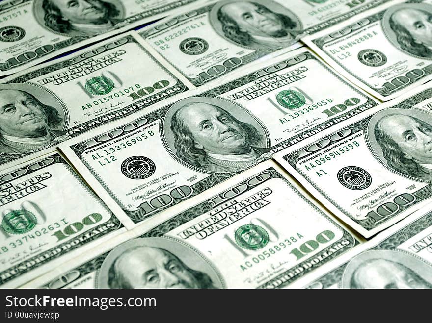 Closeup of several hundred dollar bills isolated on white background. Closeup of several hundred dollar bills isolated on white background