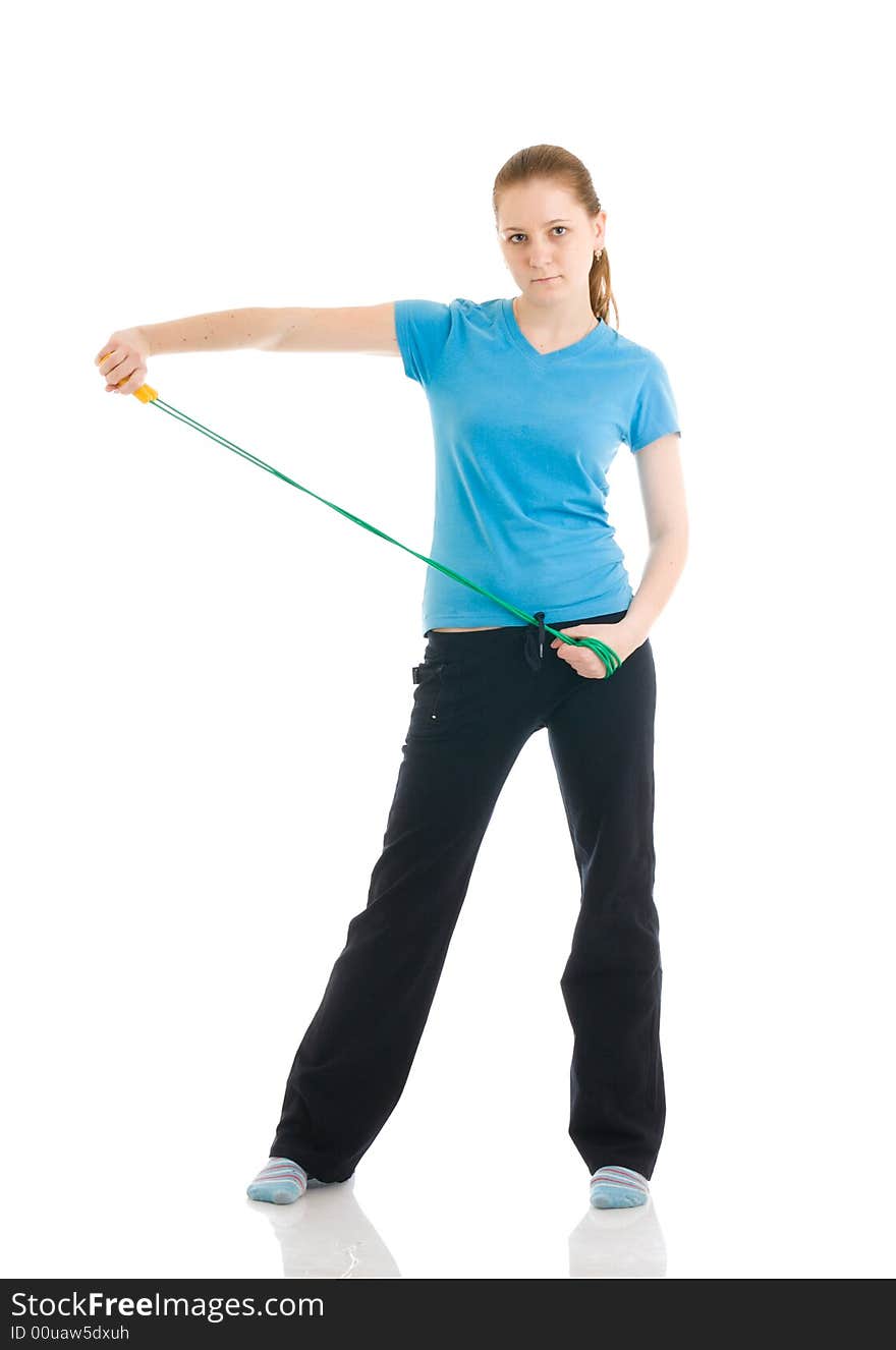 The young woman with the skipping rope isolated on a white background