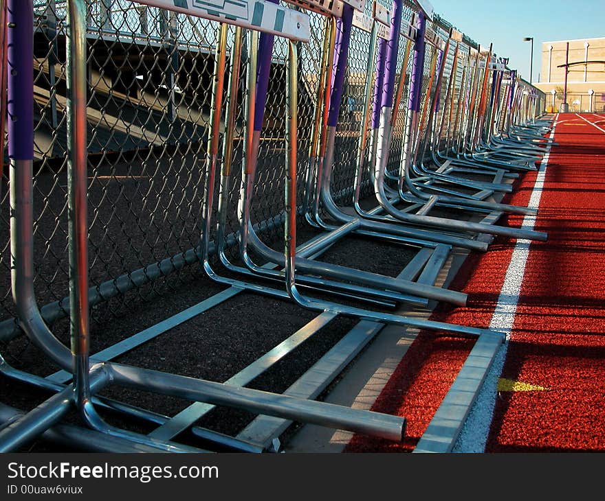 Running Track-Hurdles Along Fence