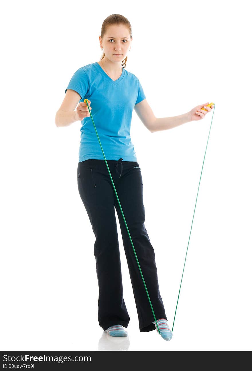 The young woman with the skipping rope isolated on a white background