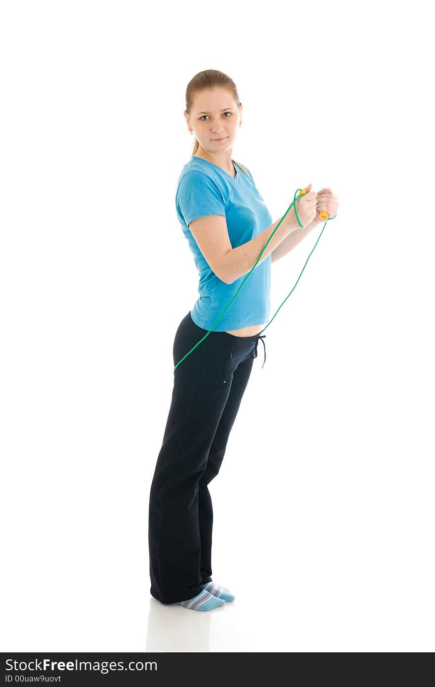 The young woman with the skipping rope isolated on a white background