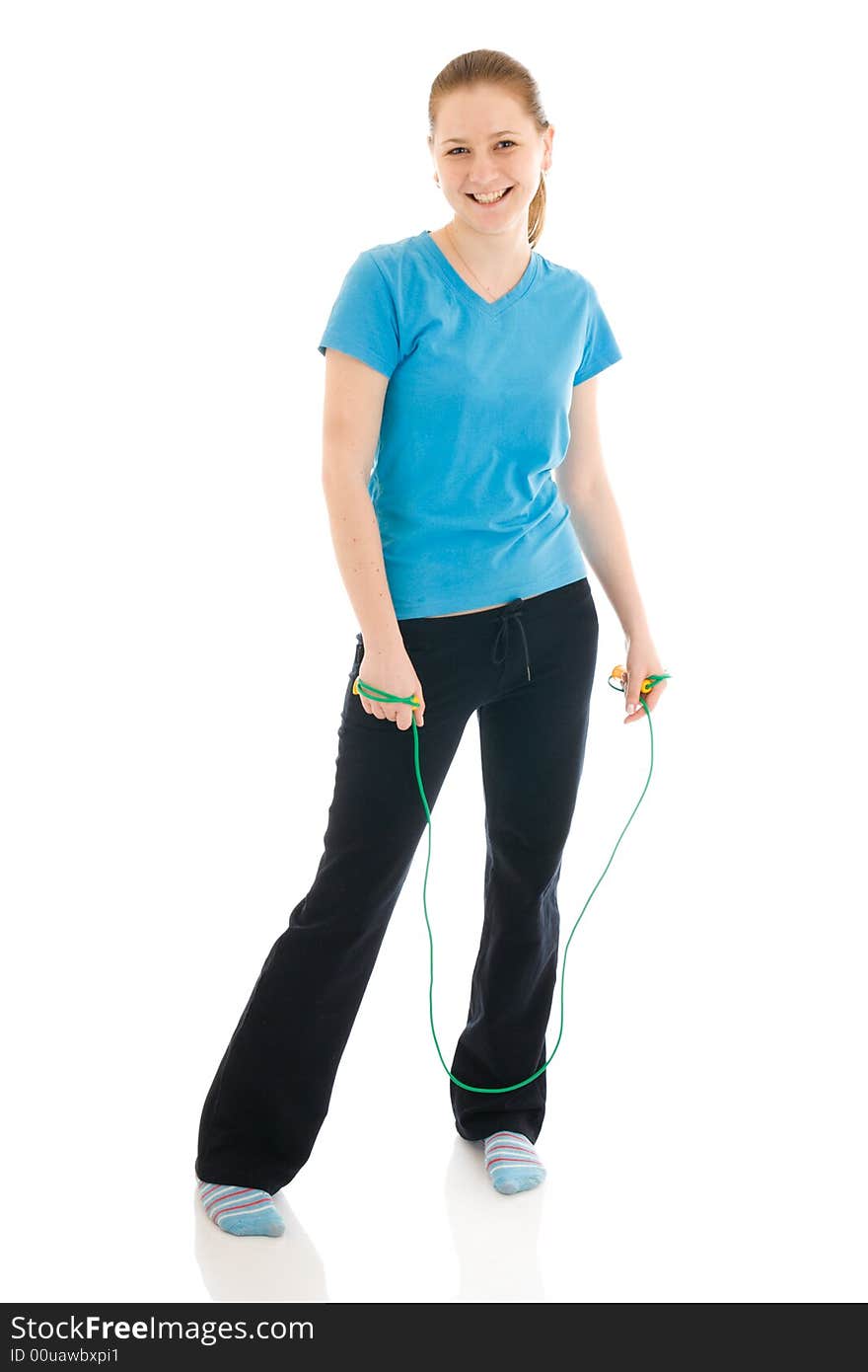 The young woman with the skipping rope isolated on a white background