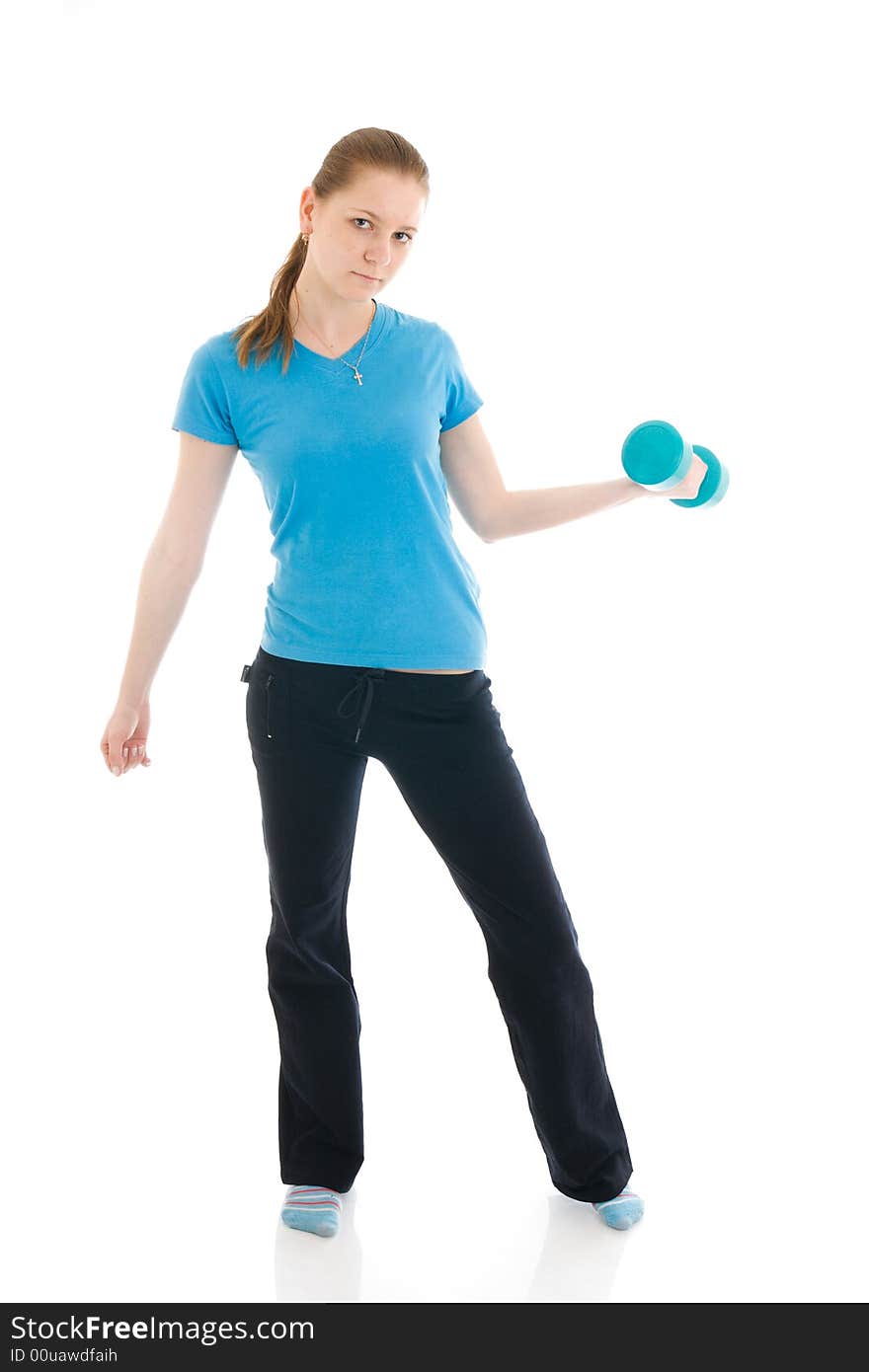 The beautiful young woman doing exercise isolated on a white background