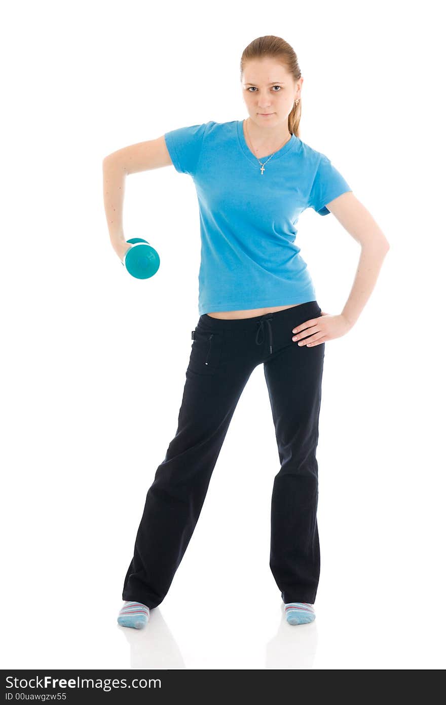 The beautiful young woman doing exercise isolated on a white background