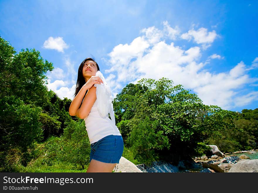 Woman with white angel wings looking up to the beautiful sky. Woman with white angel wings looking up to the beautiful sky