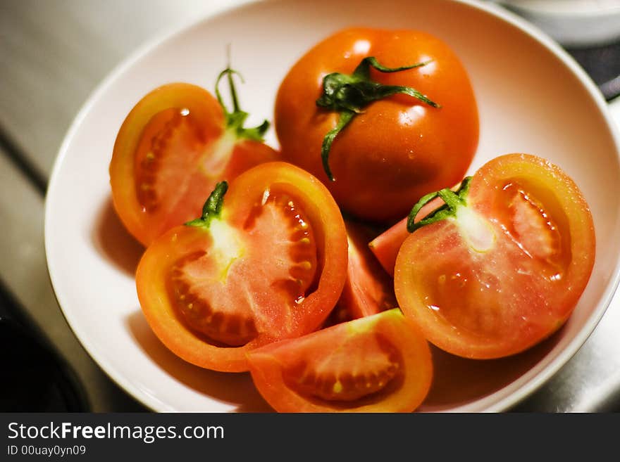 Some tomato on the plate. Some tomato on the plate