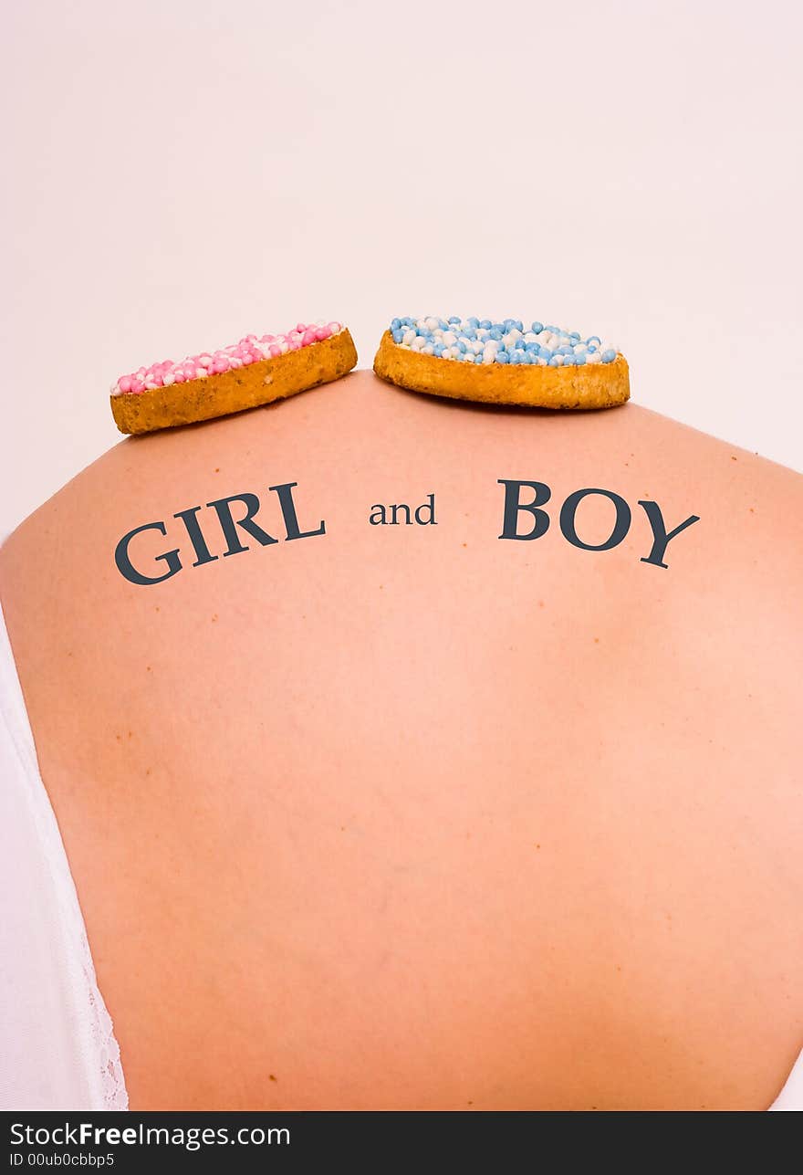 2 biscuits on belly. It is t a boy and a girl. 2 biscuits on belly. It is t a boy and a girl