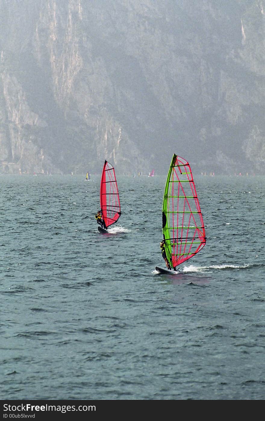 Two wind surfers on Lake Garda, Italy. Two wind surfers on Lake Garda, Italy.