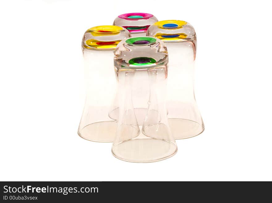 Four glasses with colored bottoms