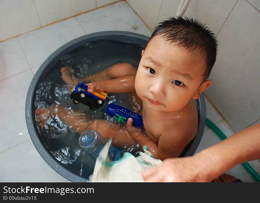 A boy taking bath