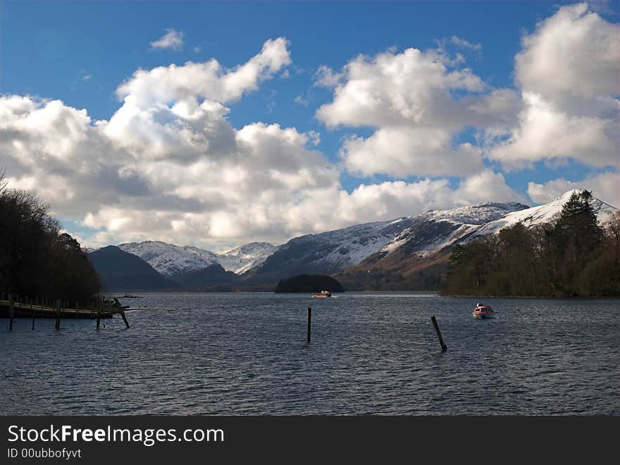 Sailing infront of snow capped mountains