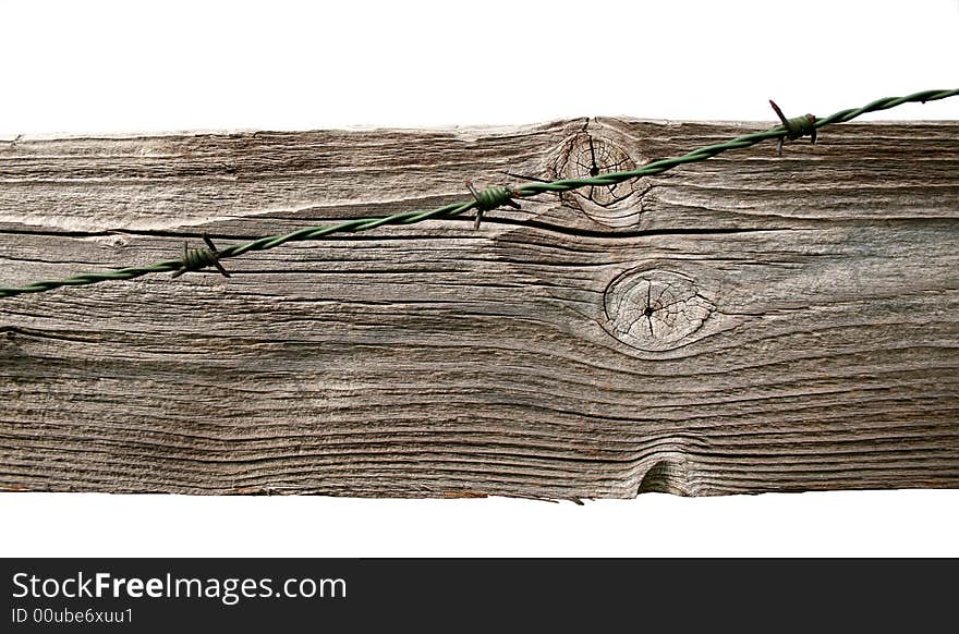 Barbwire on wooden board for a background