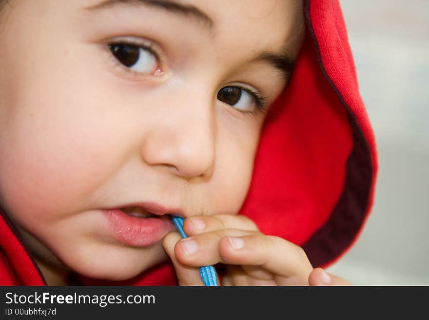 Cute little boy (4 years old) is drinking orange lemonade. Cute little boy (4 years old) is drinking orange lemonade