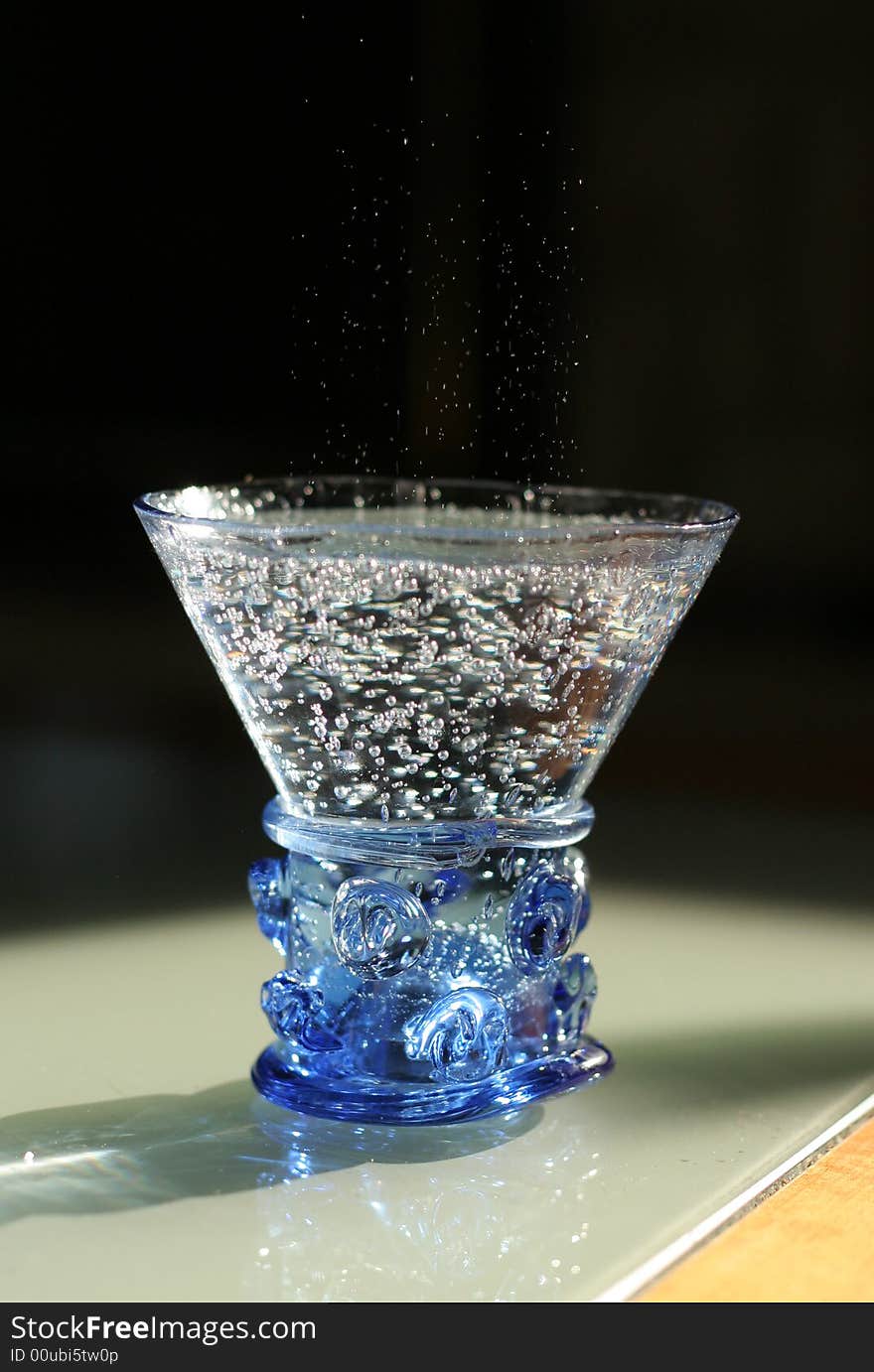 Mineral water in a figured hand-worked glass