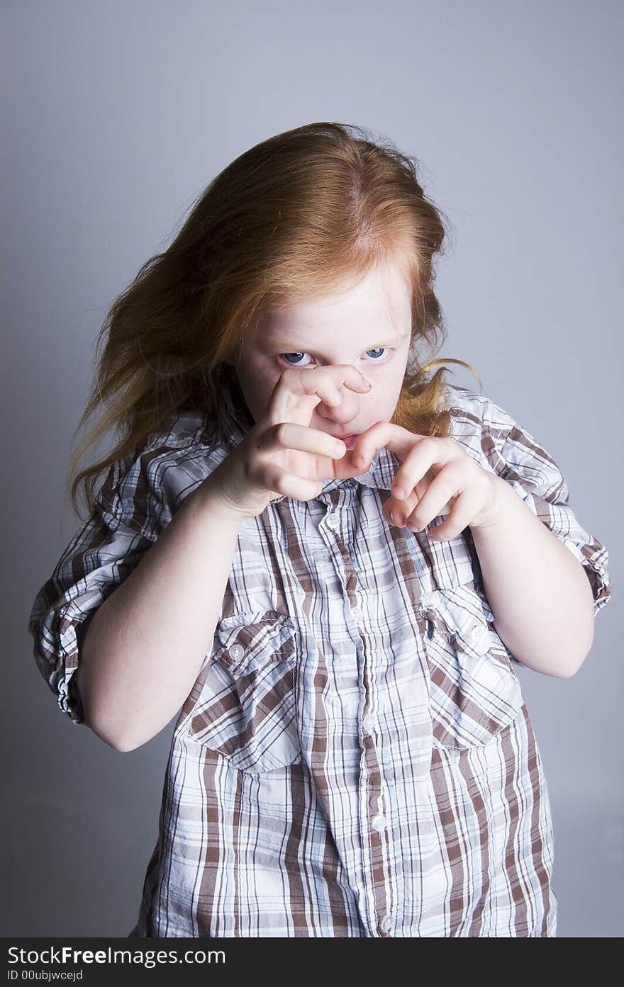 Little girl acting like a cat using her hands