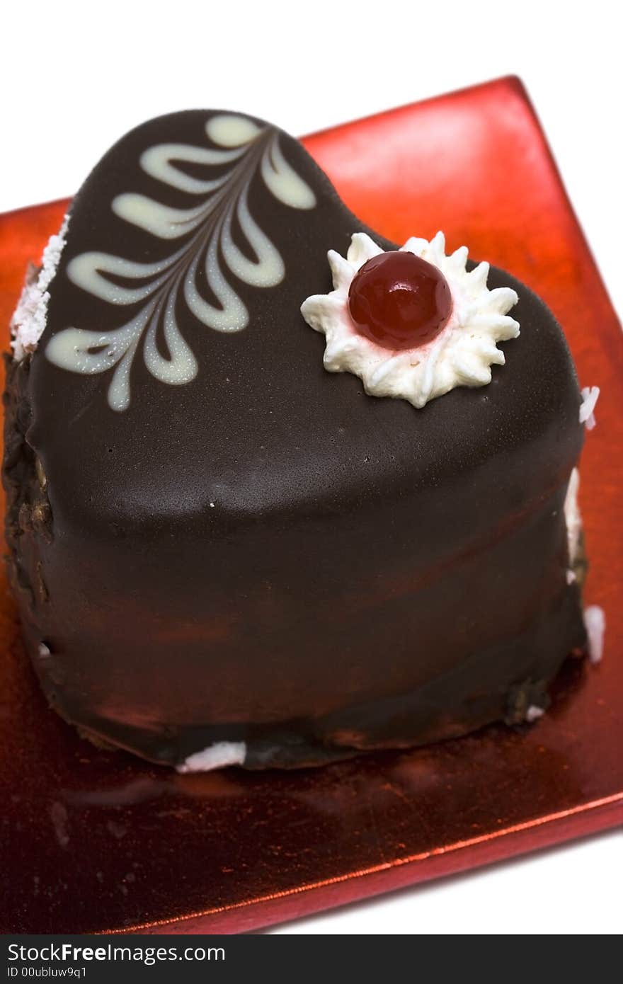 Chocolate cake on red plate