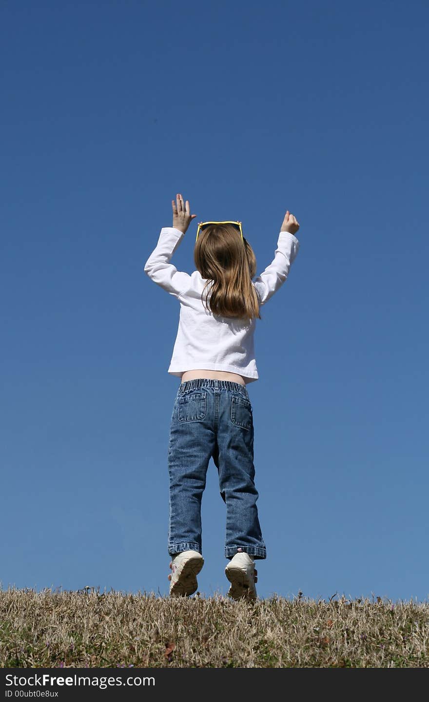 Little girl jumping up and down. Little girl jumping up and down