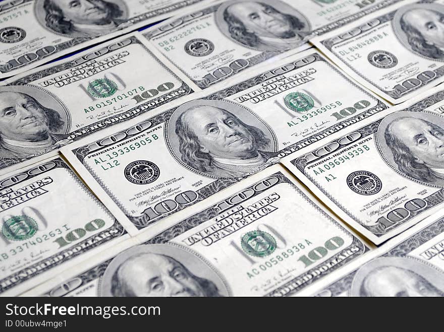 Closeup of several hundred dollar bills isolated on white background. Closeup of several hundred dollar bills isolated on white background