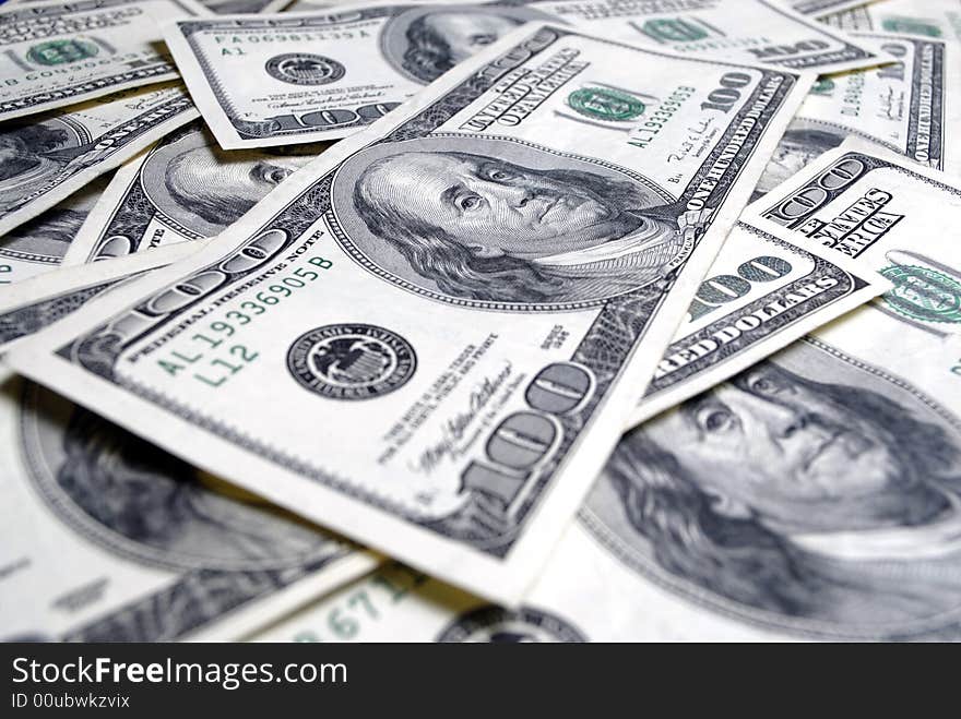 Closeup of several hundred dollar bills isolated on white background. Closeup of several hundred dollar bills isolated on white background