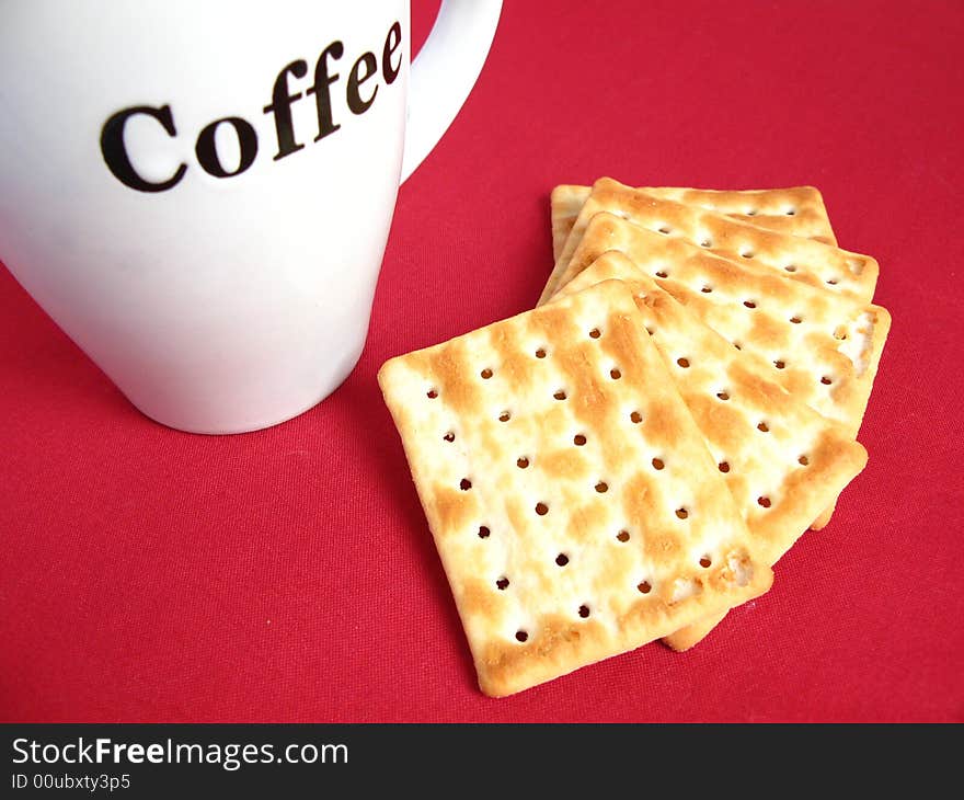 Coffee with crackers in red background. Coffee with crackers in red background.