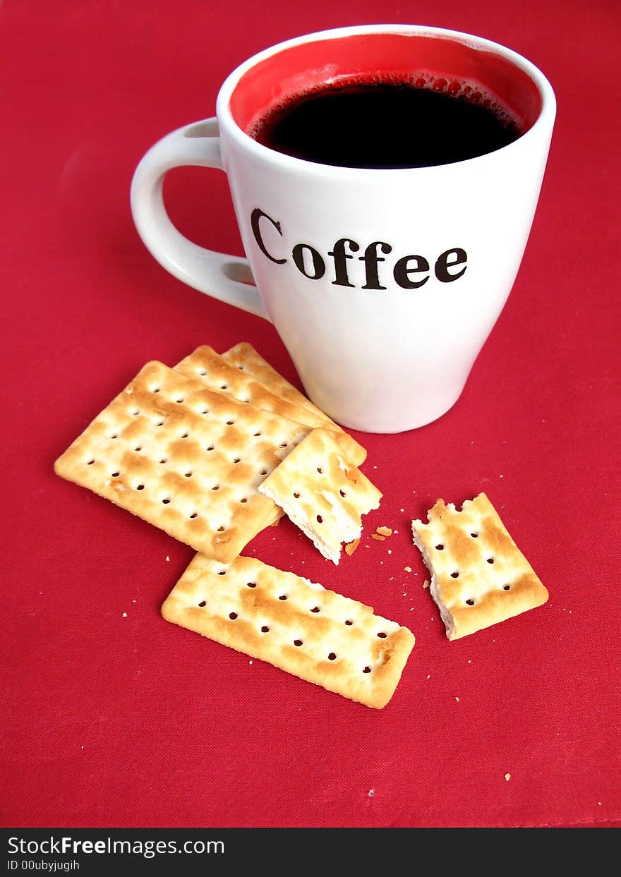 Coffee with crackers in red background. Coffee with crackers in red background.