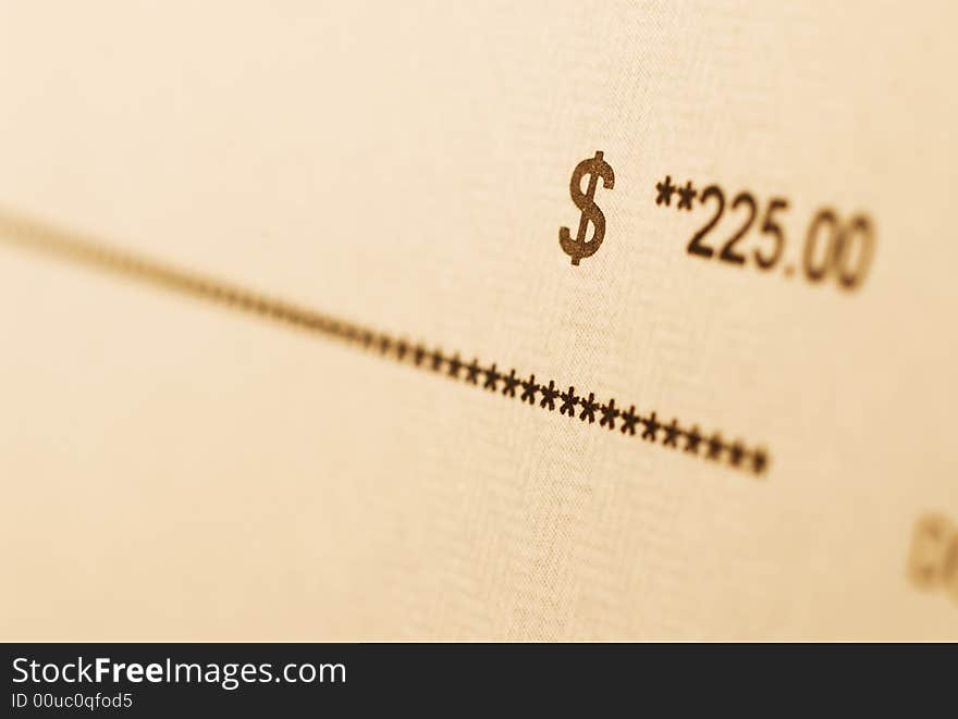 A check with amount in focus. A check with amount in focus.