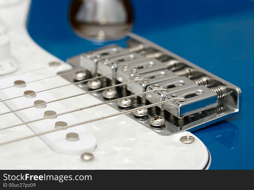 Closeup part of blue elecrtic guitar with strings. Closeup part of blue elecrtic guitar with strings