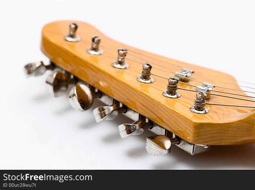 Part of guitar on the white plastic background