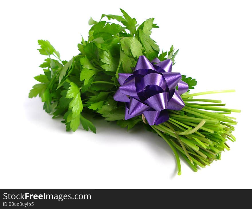 Bouquet of parsley tied with a bow, in white background.