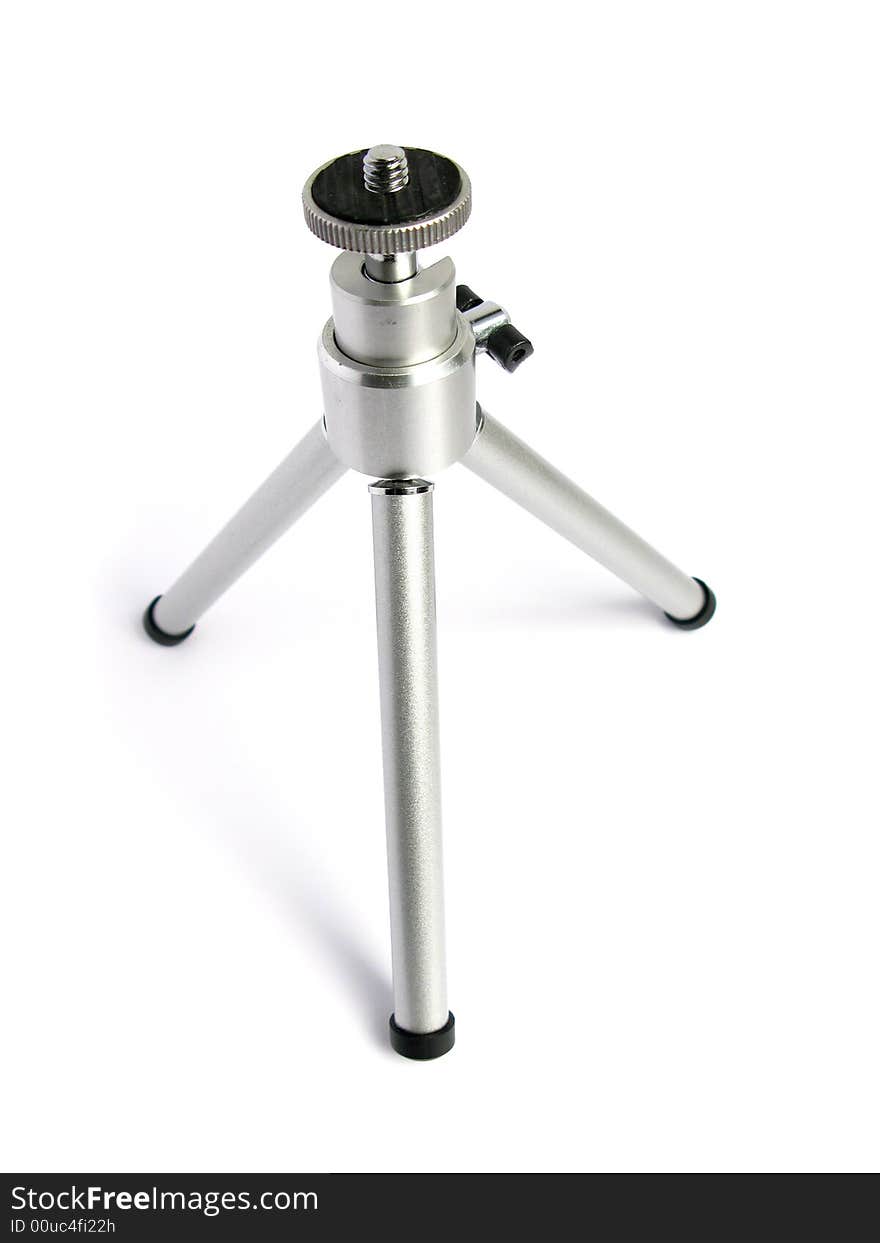 Tiny tripod open in white background.