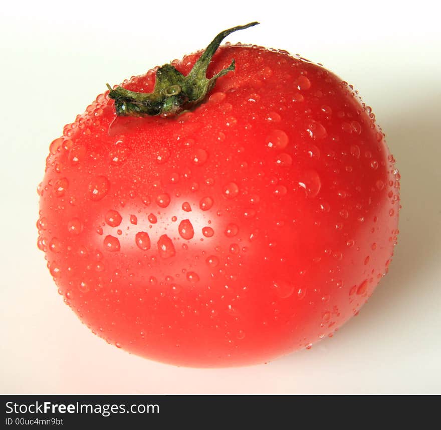 A photograph of a fresh tomato.