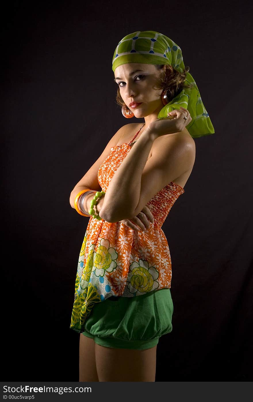 Portrait of young hispanic woman with colorful summer clothes - isolated on black. Portrait of young hispanic woman with colorful summer clothes - isolated on black