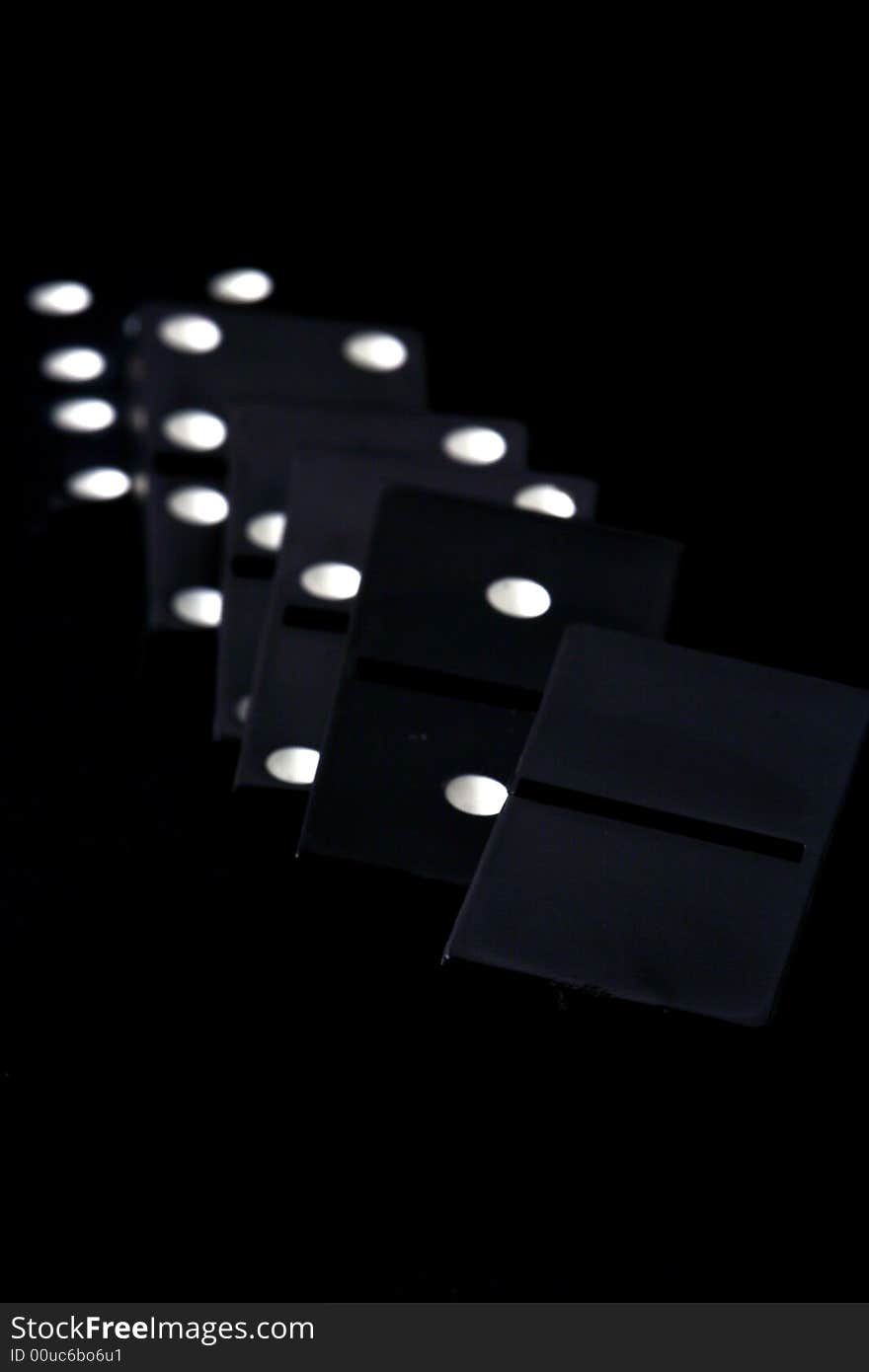 Dominoes isolated in dark background