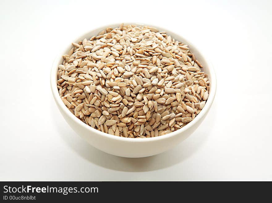 A bowl full of sunflower seeds. A bowl full of sunflower seeds